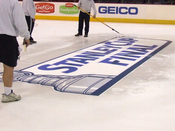Mellon Arena crew putting the Stanley Cup Final logo on the ice 