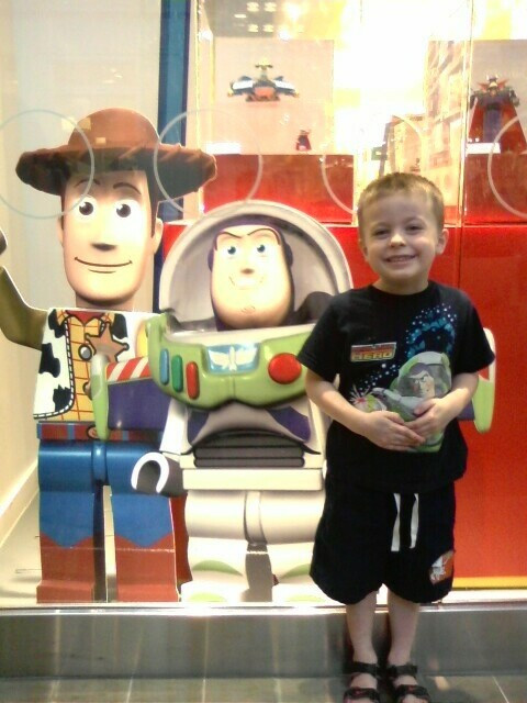 Introducing Preston to the Lego Store! He's happy!