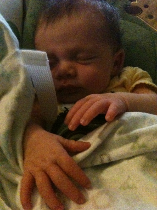 Baby sleeps as Daddy works.