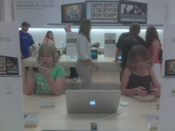 My girls geeking out at Apple Store!