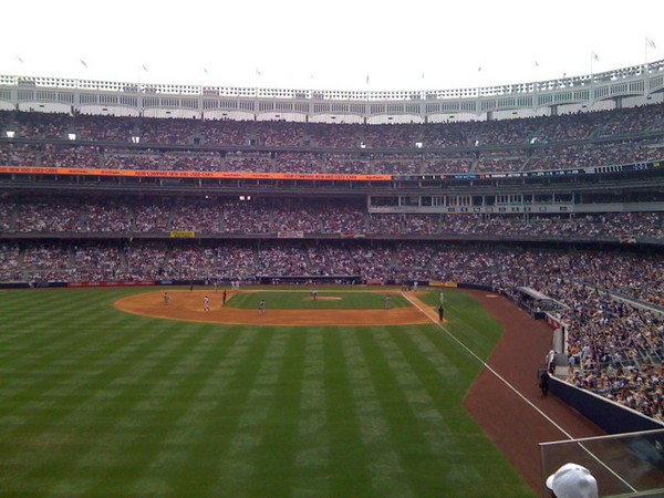 At Yankee stadium, NY Yankees v Seattle Mariners. I think it's 4 all, &amp; we're in the 7th. Update: NY 5 v Mar 4