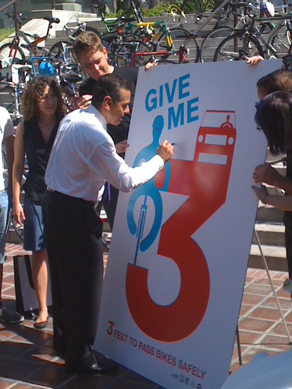 LA's Mayor signing the new campaign poster--3 Foot Law for cyclists
