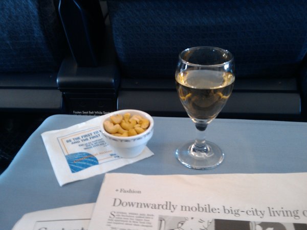 Warm cashew nuts plus a glass of sauvignon blanc on CO59 on 28 Jun 2009 at 10:11 as we pass over the port of England.