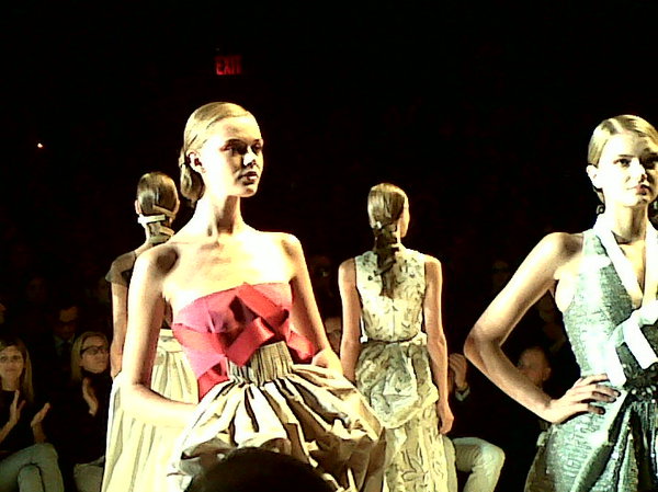 Models hair was uber sleek with large rectangular barettes. Carolina Herrera. #nyfw #mbfw