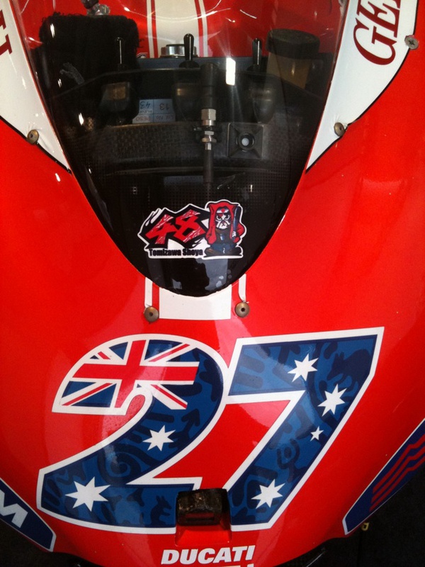 All the bikes are carrying this sticker in memory of Shoya Tomizawa.