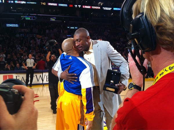 Kobe Bryant &amp; @DerekFisher present D.J. Mbenga with his 2010 NBA Championship ring.