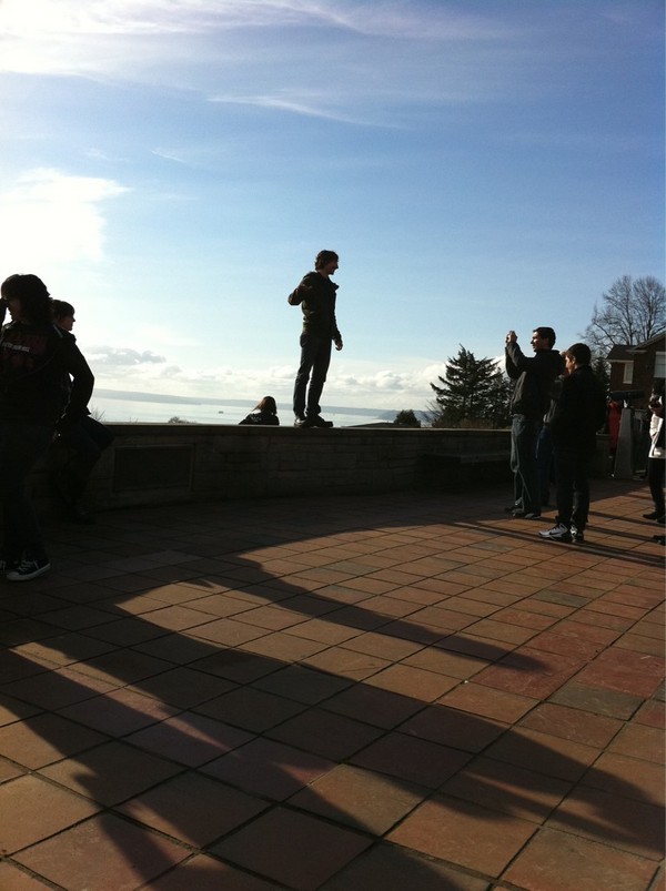 Watching tourists try to line shots up so they're patting, poking, biting or sitting on the Space Needle: 