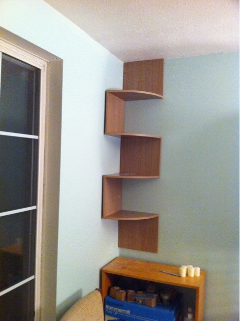 Holy shit. I assembled a corner shelf, and @schnuth helped fasten it to the wall. New home for my camera collection!