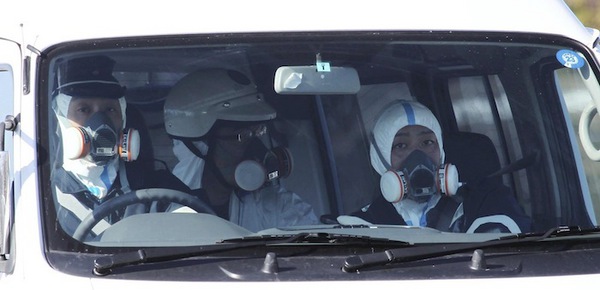 Photo: Police officers near Fukushima nuclear plant wear gas masks #tsunami (Reuters) 