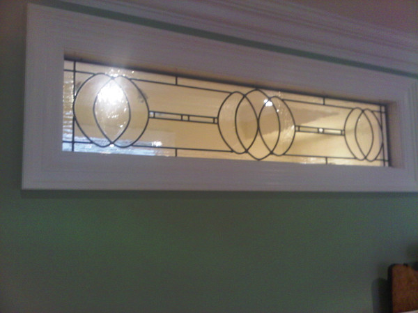 Transom installed today...design detail throughout this project.."ovals"  Beautiful clarity with the antique glass used and the bevels. http://www.glassworksstudio.ca

