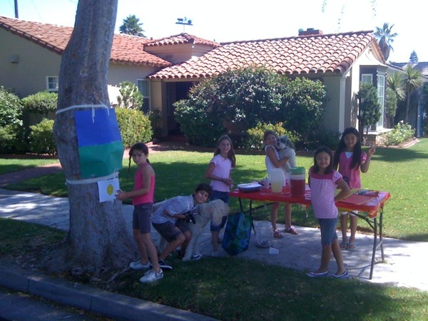 Daughters lemonade stand with friends, using our dogs as props to boost cuteness factor
