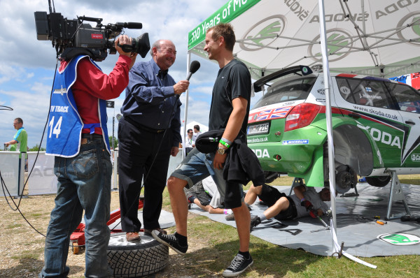 Tony Mason interviews Juho Hänninen eye to eye at #Goodwood - with a little help from a ŠKODA Fabia S2000 wheel! #irc
