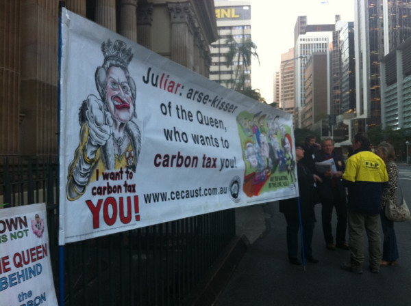 Protest banner outside the carbon price forum. Apparently it's the queen's fault. OK then... 