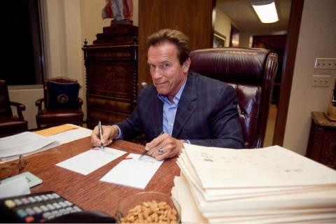 Going all out, signing two bills at once.