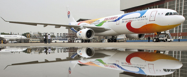 China Eastern Airlines unveils an Airbus 330-300 aircraft painted with patterns of 2010 Expo themes at Hongqiao Airport.
