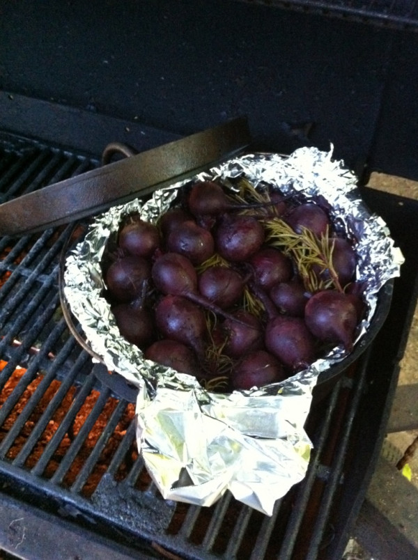 Roasting beets with rosemary and olive oil on the grill.