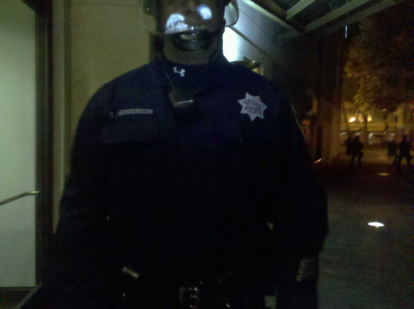 The police officers here don't seem to be wearing badge numbers.  #occupyoakland