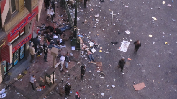 8 unmoving bodies in tahrir, pic i took 3 hours ago, just got to computer 2 upload. not sure how many dead vs. unconscious. corner of #tahrir sq &amp; tahrir st.