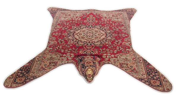 'Bärenjäger' carpet by Lise Lefebvre is her newest 'Blanket Statement' piece made from a reformed Persian rug, taxidermy bear head, glass eyes, & custom paint.