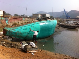 #wukan fishermen painting boats, not allowed out to fish
