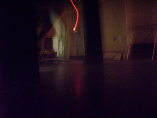 Backstage, old HTC, I had just said that they were going to tear down the place...(turn it clockwise to see the face -- the light flare from the back door had to have traveled twenty feet to reach the pull aside curtain, looks like a grey, frowny "Casper")