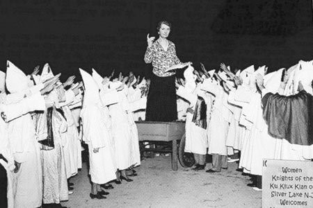 Photo of Margaret Sanger speaking in front of the KKK.