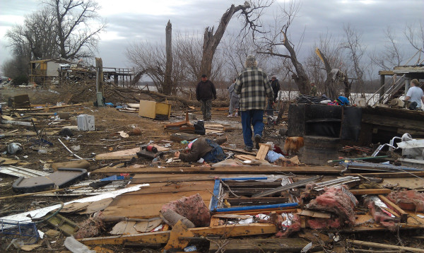 Neighbors and friends searching through rubble at nugent drive