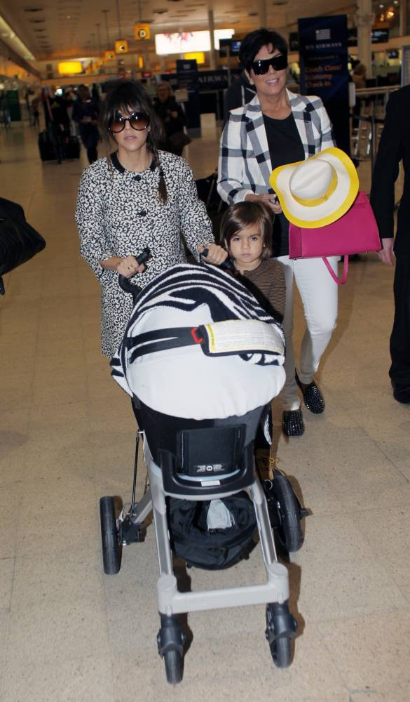 Kourtney, Kris, Mason and Penelope at Heathrow Airport in London, UK today