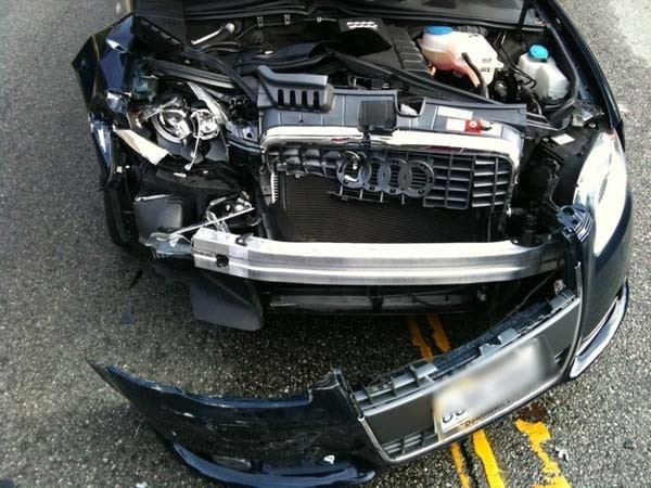 This is what can happen when ur on the phone & not paying attention. I'm glad she was alright, but her car wasn't: