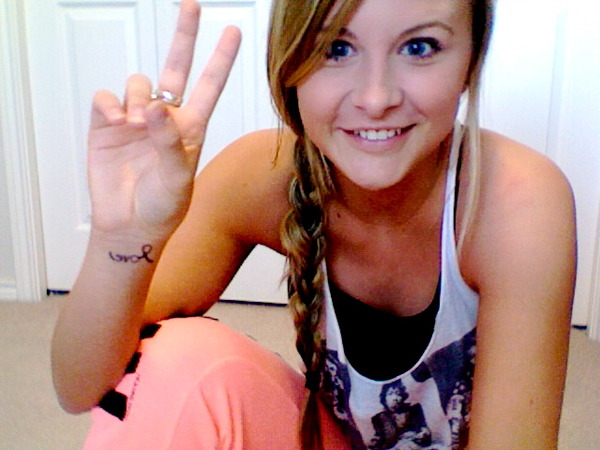 Just got a TATTOO!! I'm so excited. It says LOVE. & Yes, it's written backwards. Thought I'd be different!