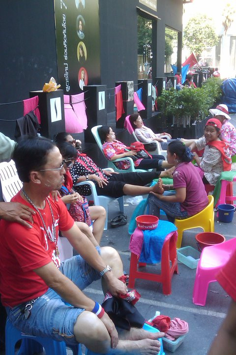 #redshirts in Bangkok get foot massages to release tension